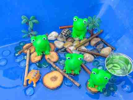 4 Green Speckeled Frogs Sensory bin