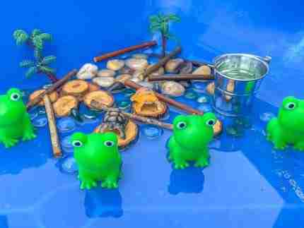 4 Green Speckeled Frogs Sensory bin
