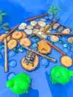 4 Green Speckeled Frogs Sensory bin