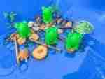 4 Green Speckeled Frogs Sensory bin