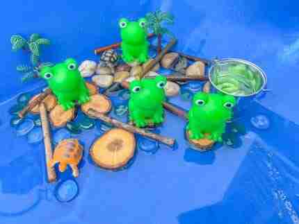 4 Green Speckeled Frogs Sensory bin