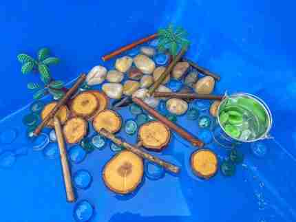 4 Green Speckeled Frogs Sensory bin