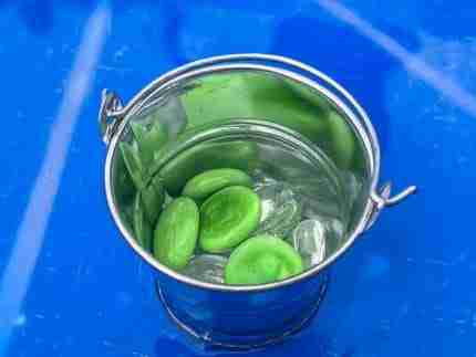 4 Green Speckeled Frogs Sensory bin