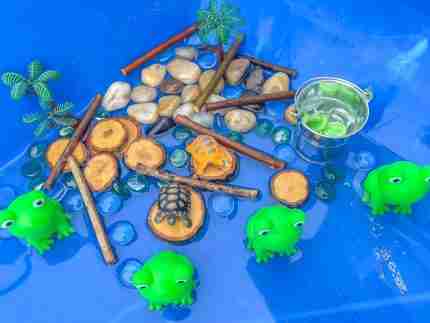 4 Green Speckeled Frogs Sensory bin