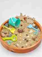 Beach sensory bin with sand and tools