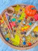 Leaves and Popcorn Fall Sensory Bin