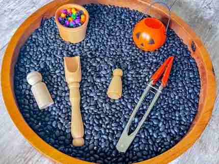 Black bean halloween sensory bin