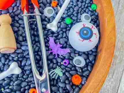 Black bean halloween sensory bin