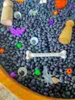 Black bean halloween sensory bin
