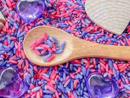 pink and purple sensory rice