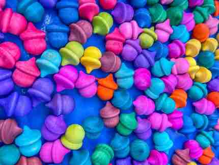 Watercolor dyed wooden acorns for sensory play