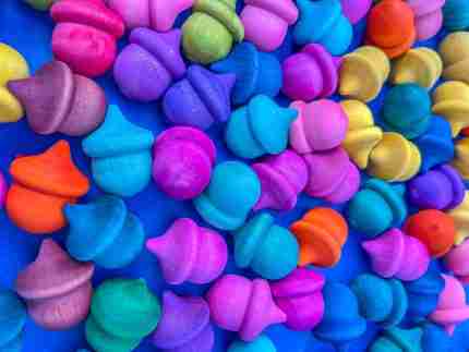 Watercolor dyed wooden acorns for sensory play