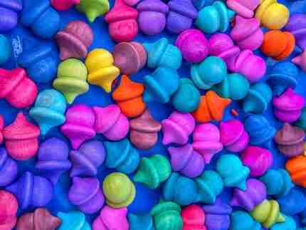 Watercolor dyed wooden acorns for sensory play