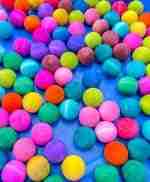 Watercolor dyed wooden acorns for sensory play