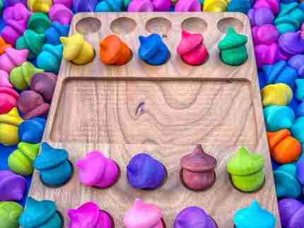 Watercolor dyed wooden acorns for sensory play