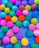 Watercolor dyed wooden balls for sensory play
