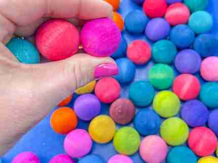 Watercolor dyed wooden balls for sensory play