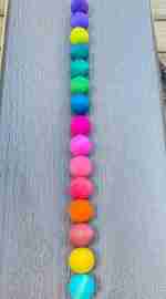 Watercolor dyed wooden balls for sensory play