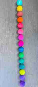 Watercolor dyed wooden balls for sensory play