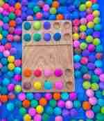 Watercolor dyed wooden balls for sensory play