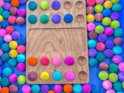 Watercolor dyed wooden balls for sensory play