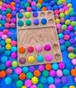 Watercolor dyed wooden balls for sensory play