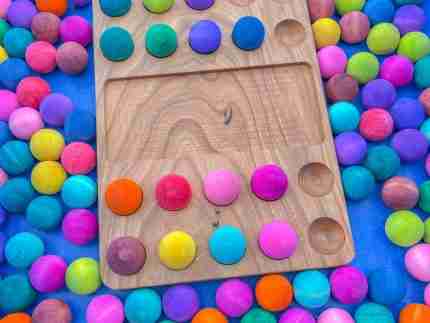 Watercolor dyed wooden balls for sensory play
