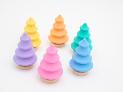 Pastel wooden trees in pink, yellow, peach, mint, blue, and lavender with natural wood bases