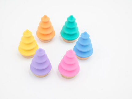 Pastel wooden trees in pink, yellow, peach, mint, blue, and lavender with natural wood bases