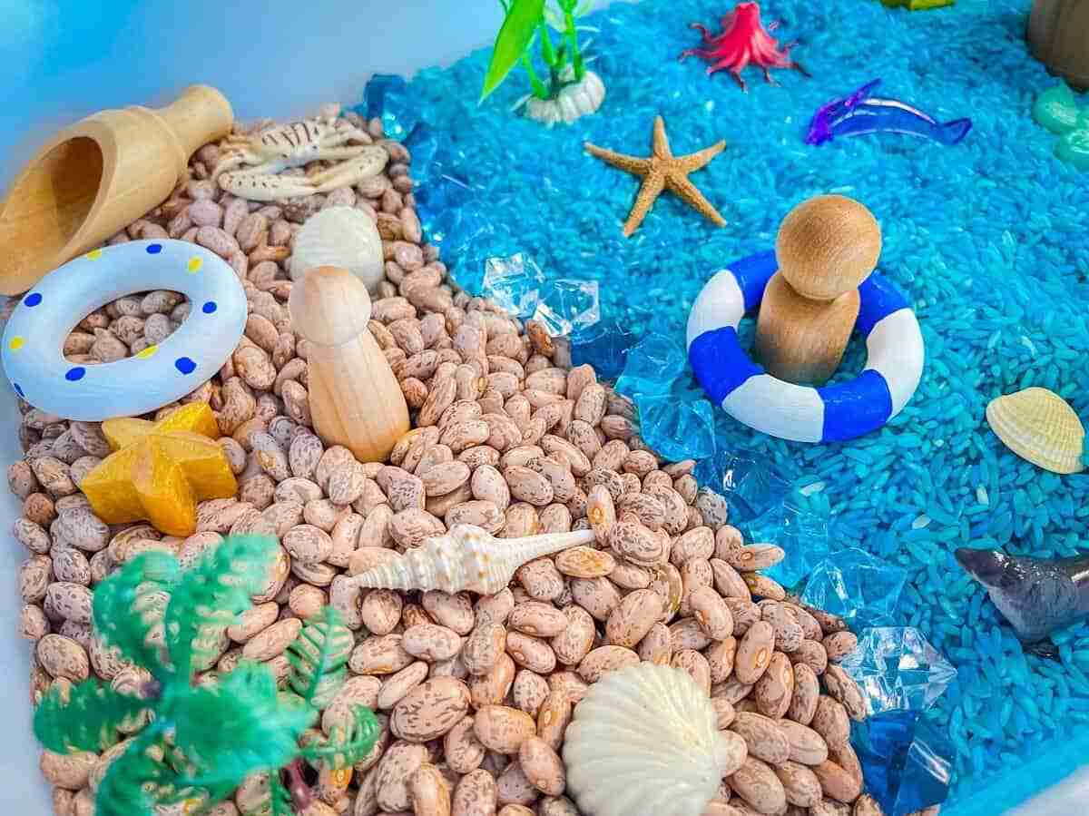 Beach themed group of objects on a sensory bin