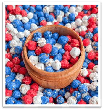 A bowl of red white and blue balls
