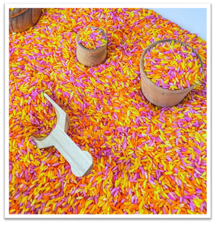 A colorful rice with a wooden spoon