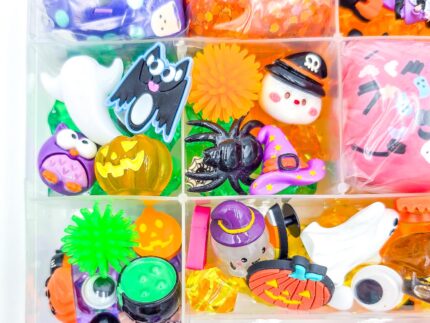 Deluxe Halloween Playdough Kit with four playdough balls, ghost, spider, and pumpkin charms in a clear case