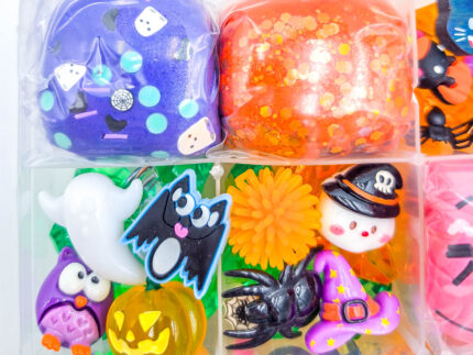 Deluxe Halloween Playdough Kit with four playdough balls, ghost, spider, and pumpkin charms in a clear case