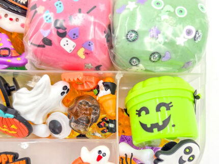 Deluxe Halloween Playdough Kit with four playdough balls, ghost, spider, and pumpkin charms in a clear case