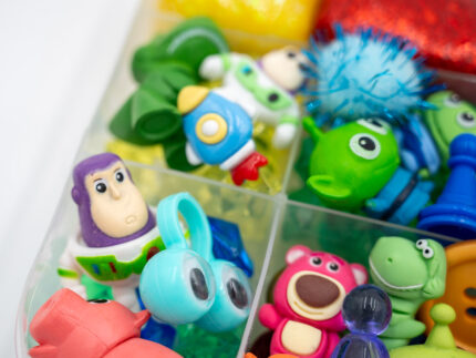 Deluxe Toy Story Play-Doh Kit with colorful glitter dough, character figures, gems, pom-poms, and themed sensory play pieces