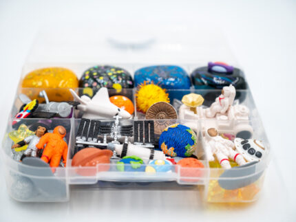 Deluxe Outer Space Play-Doh Kit with colorful dough, astronauts, rockets, planets, spacecraft, and space-themed sensory pieces