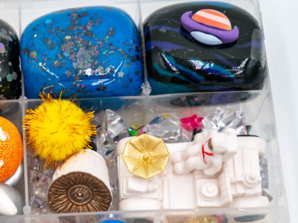 Deluxe Outer Space Play-Doh Kit with colorful dough, astronauts, rockets, planets, spacecraft, and space-themed sensory pieces