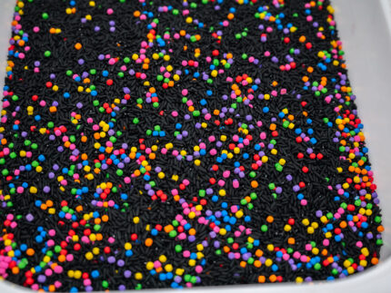 Midnight Rainbow sensory filler with black rice and colorful rainbow couscous