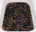 Midnight Rainbow sensory filler with black rice and colorful rainbow couscous