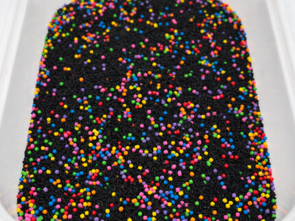 Midnight Rainbow sensory filler with black rice and colorful rainbow couscous