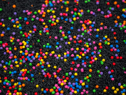 Midnight Rainbow sensory filler with black rice and colorful rainbow couscous