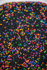 Midnight Rainbow sensory filler with black rice and colorful rainbow couscous
