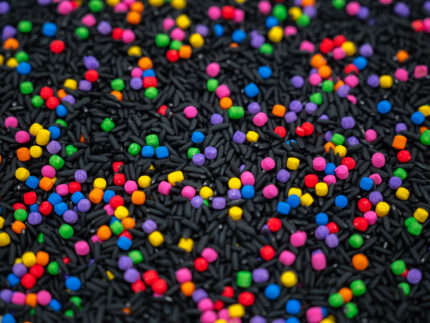 Midnight Rainbow sensory filler with black rice and colorful rainbow couscous