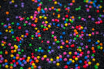 Midnight Rainbow sensory filler with black rice and colorful rainbow couscous