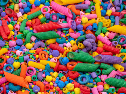 Rainbow Explosion Sensory Filler Mix with colorful rice pasta chickpeas and pearls