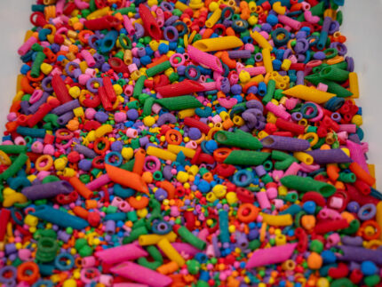 Rainbow Explosion Sensory Filler Mix with colorful rice pasta chickpeas and pearls