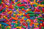 Rainbow Explosion Sensory Filler Mix with colorful rice pasta chickpeas and pearls