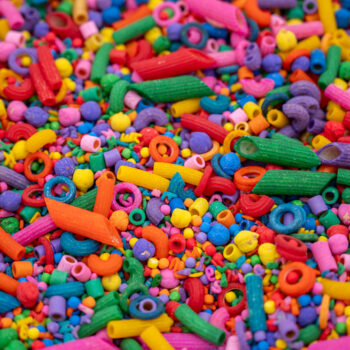 Rainbow Explosion Sensory Filler Mix with colorful rice pasta chickpeas and pearls