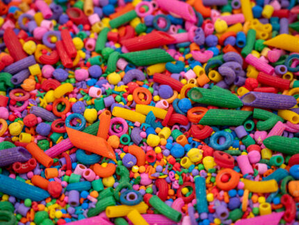 Rainbow Explosion Sensory Filler Mix with colorful rice pasta chickpeas and pearls